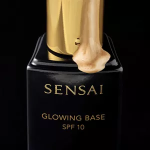 Close up of Glowing Base with product coming down bottle showcasing the texture